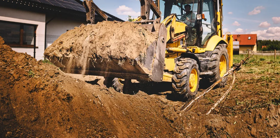 Residential excavation in Dallas using heavy equipment for precise soil removal