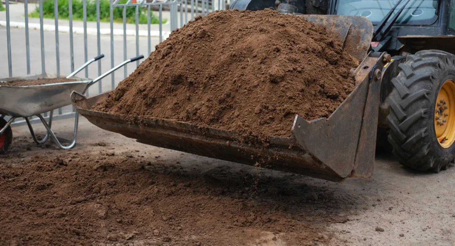 Residential driveway excavation in Dallas preparing ground for concrete or asphalt installation